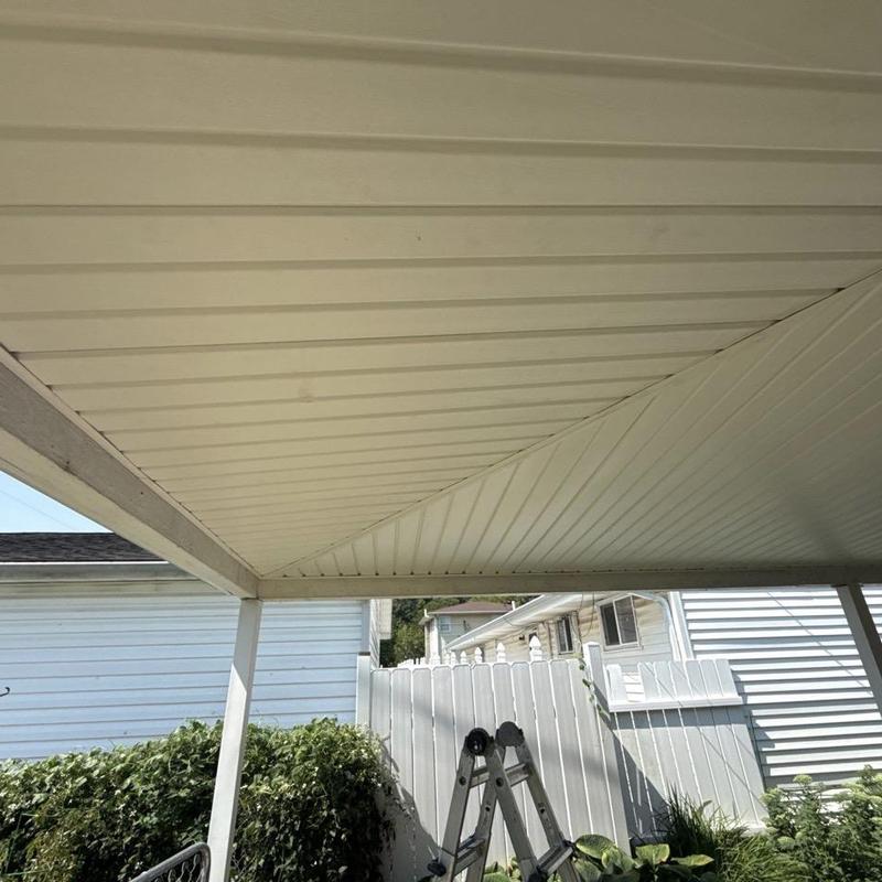 Vinyl soffit installation on residential carport ceiling Vinyl soffit installation on residential carport ceiling