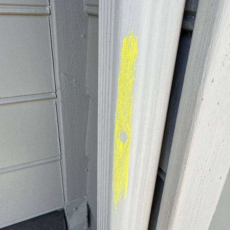 Exterior trim with marked hail damage spot