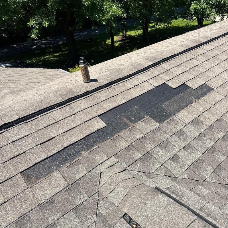 Asphalt shingles with hail damage on residential roof