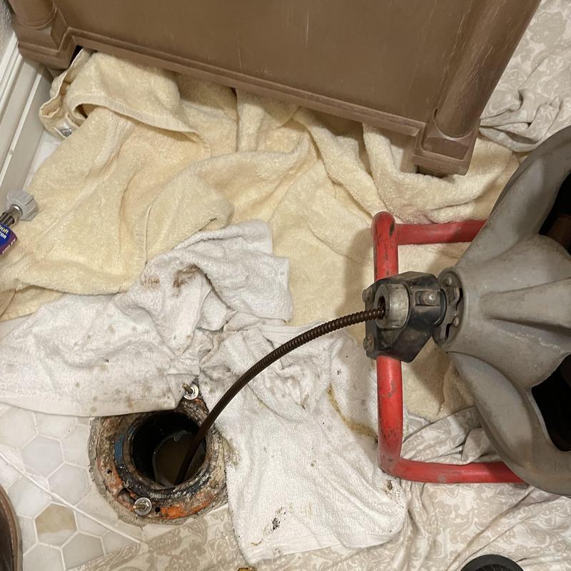 Drain line with plumbing snake during inspection