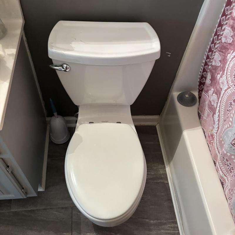 Toilet installation with hydraulic cement and caulking