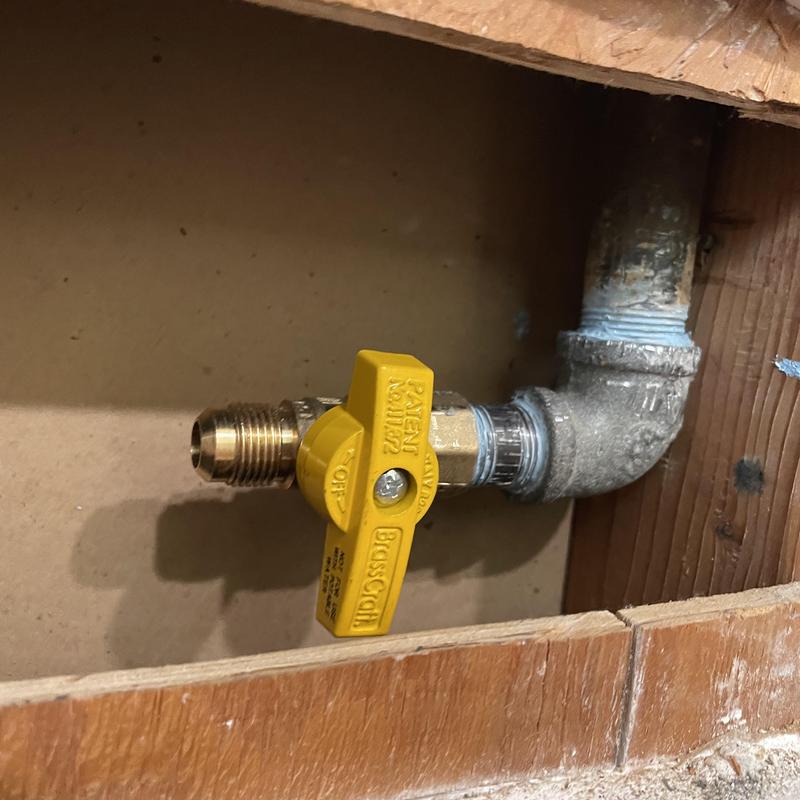 Gas valve repositioned in drywall opening Gas valve repositioned in drywall opening