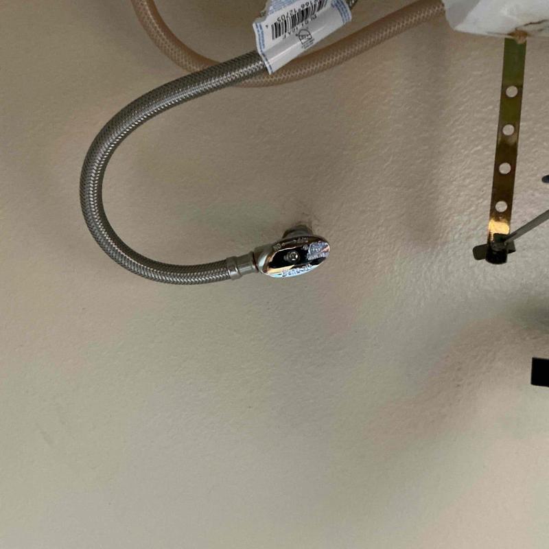 Angle stop valve with braided supply line installed Angle stop valve with braided supply line installed