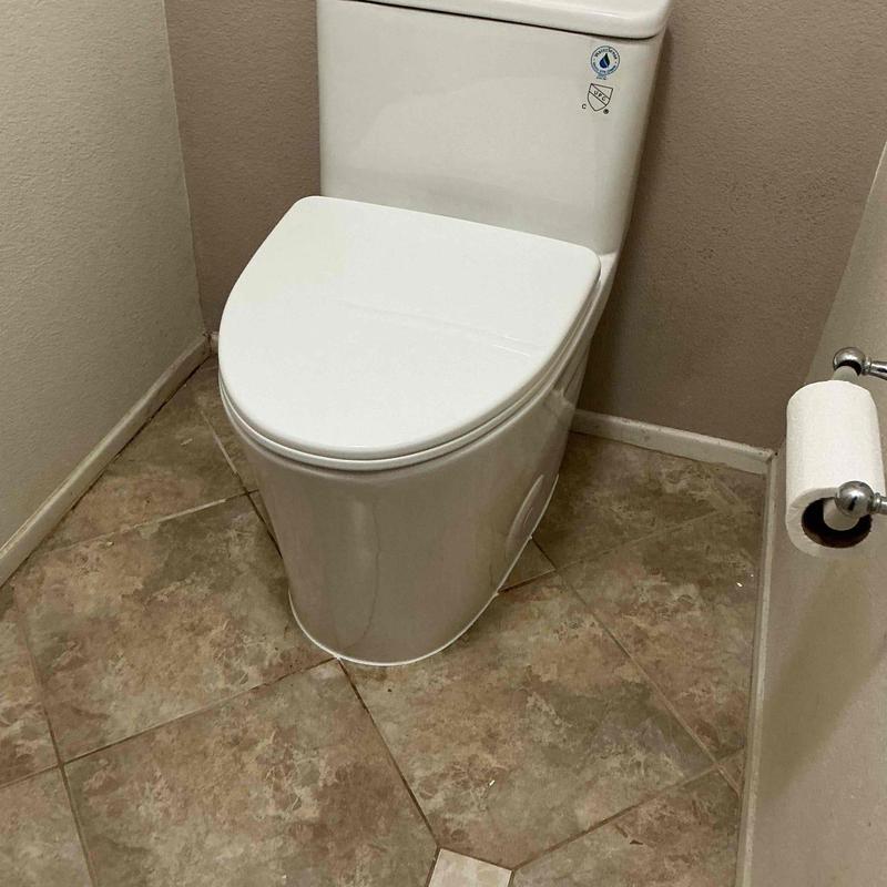 Toilet with new wax ring installation in bathroom Toilet with new wax ring installation in bathroom
