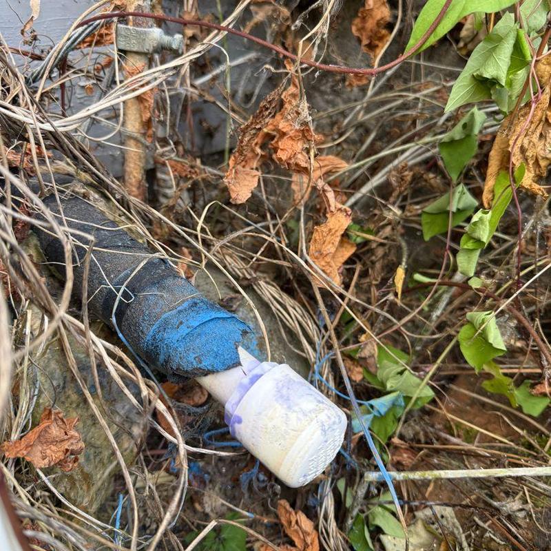Water line capped with permanent fitting outdoors