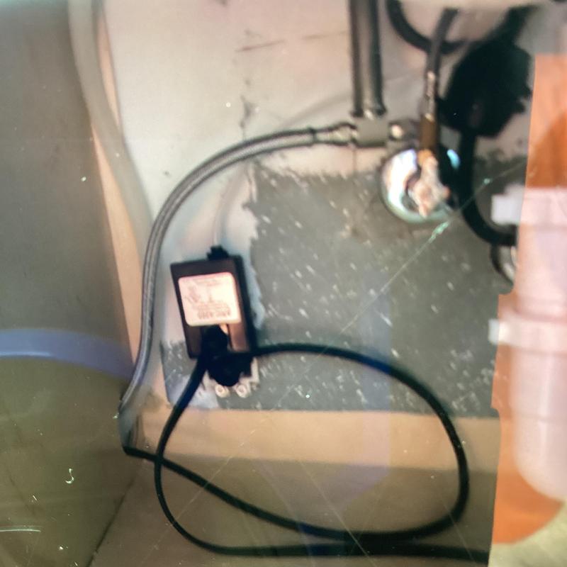 Dishwasher power outlet and water supply connections under sink