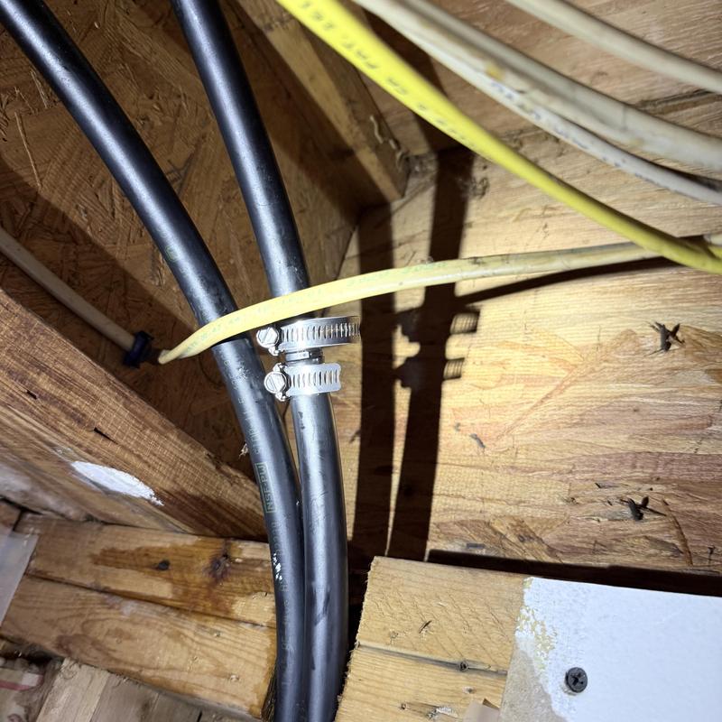 Pex water lines with hose clamps in wooden frame Pex water lines with hose clamps in wooden frame