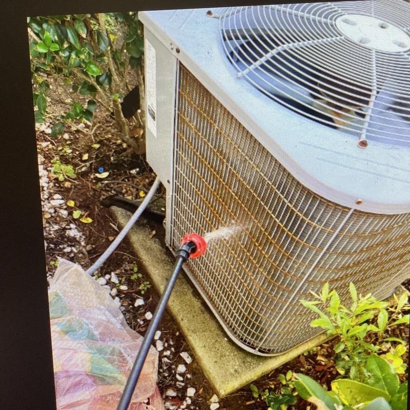 Split system condenser coil cleaning with hose spray Split system condenser coil cleaning with hose spray