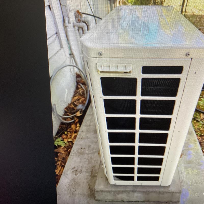 Condenser unit with cleaned and cleared airflow vents Condenser unit with cleaned and cleared airflow vents