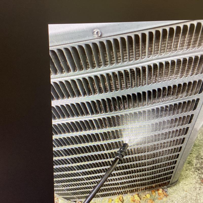 Air conditioner coil cleaning with pressure washer spray Air conditioner coil cleaning with pressure washer spray