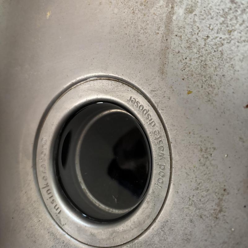 Kitchen sink drain with removed P-trap and drain opening