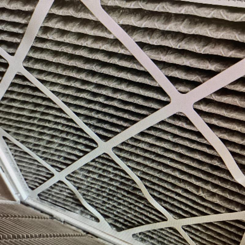 Air conditioner filter with dust buildup in frame Air conditioner filter with dust buildup in frame