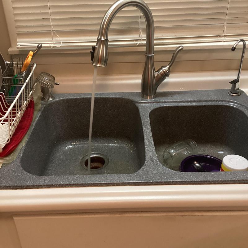 Kitchen faucet with running water in double sink