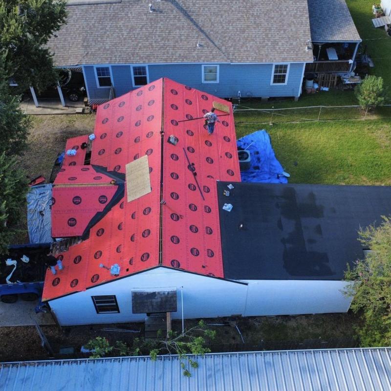 Synthetic roofing underlayment installation on residential roof