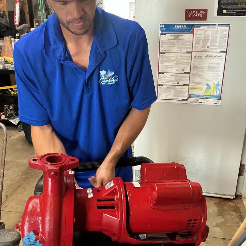 Recirculating hot water pump installation in progress