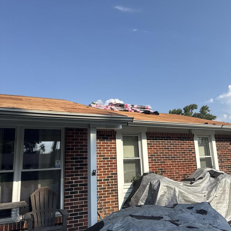 Shingle roof plywood decking with materials staged