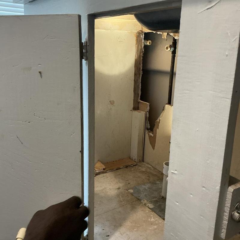 Toilet flange repair with exposed plumbing wall cavity