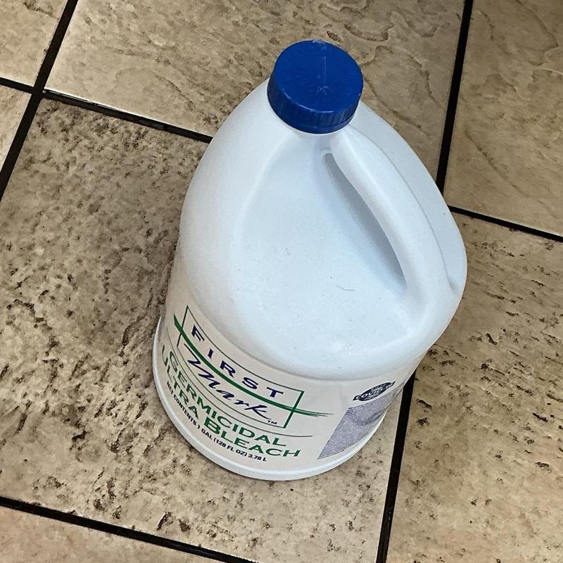 Gallon of germicidal bleach for drain cleaning