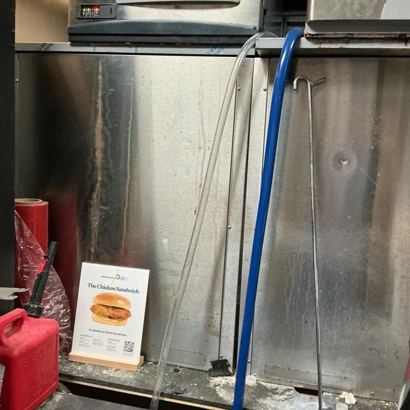 Drain line cleaning tools and hoses in commercial kitchen