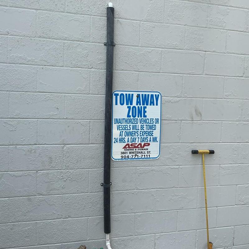 Backflow preventer pipe installation on exterior wall
