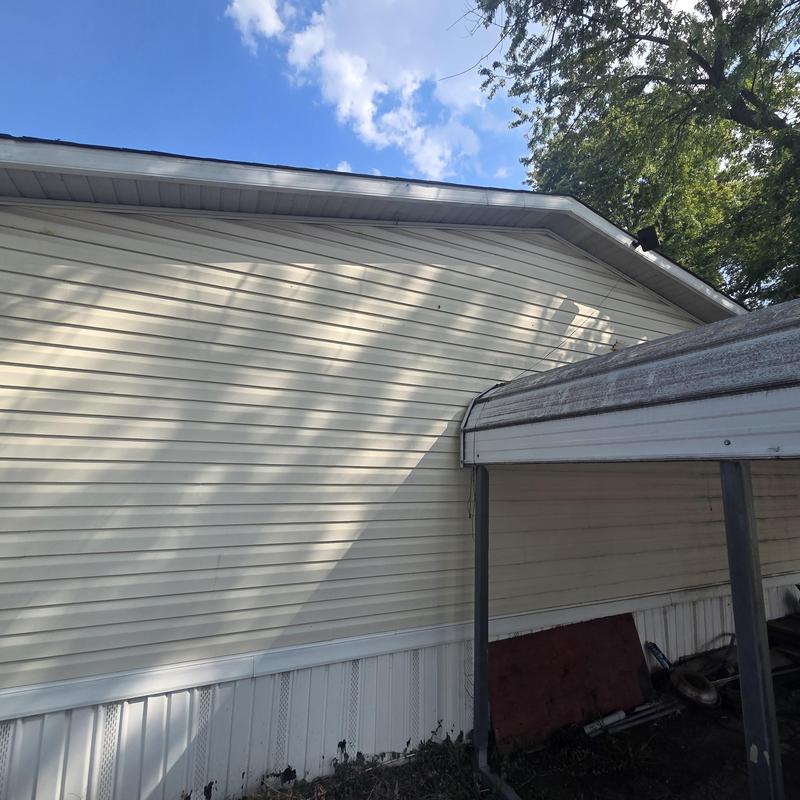 Roof with fallen tree damage and carport in Fenton