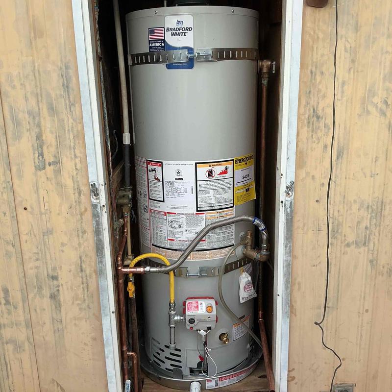 Bradford White water heater installed in closet
