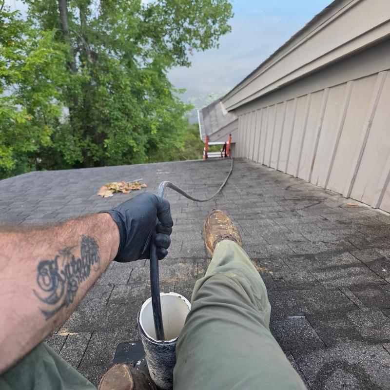 Bathroom drain jetting from roof vent on residential roof