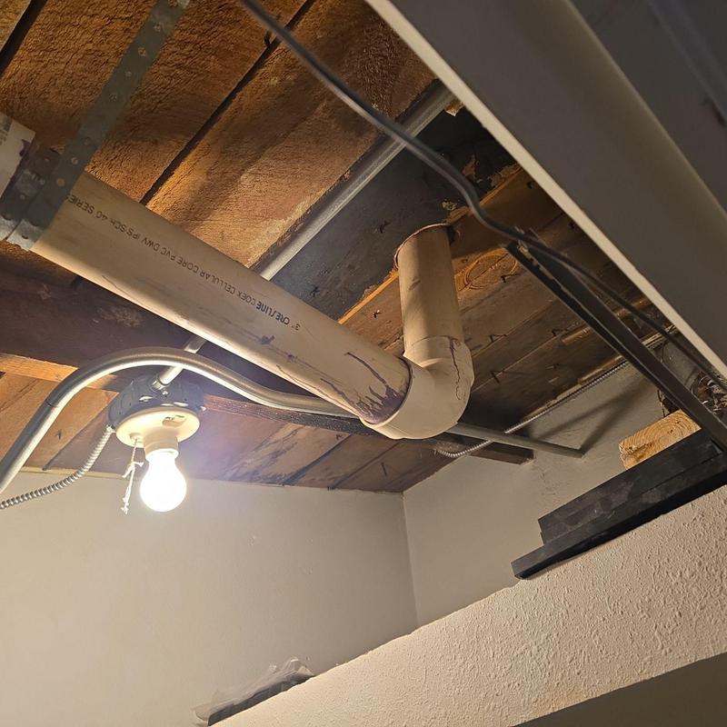 Pipe flashing on flat roof with damage