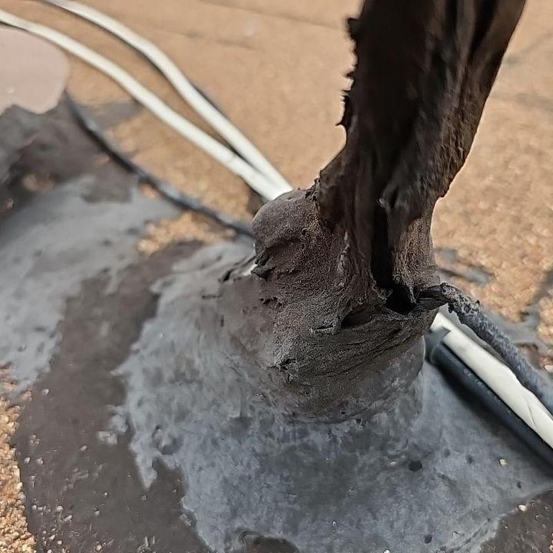 Pipe flashing on flat roof with damaged sealant