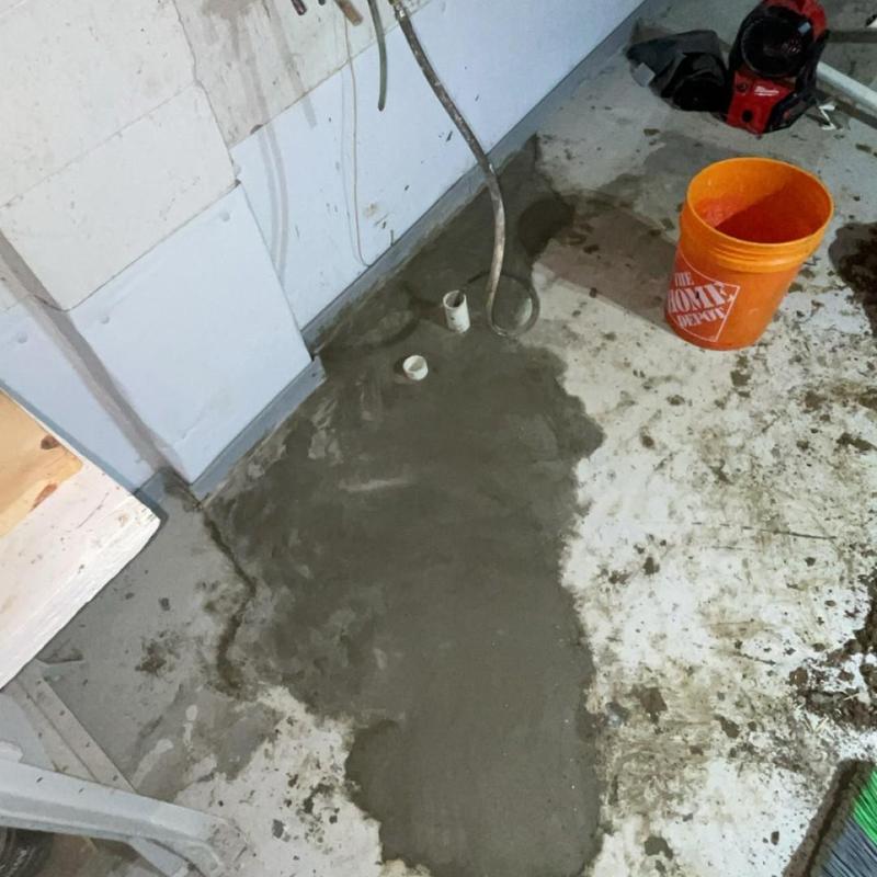 Laundry and kitchen drain installation with concrete patch