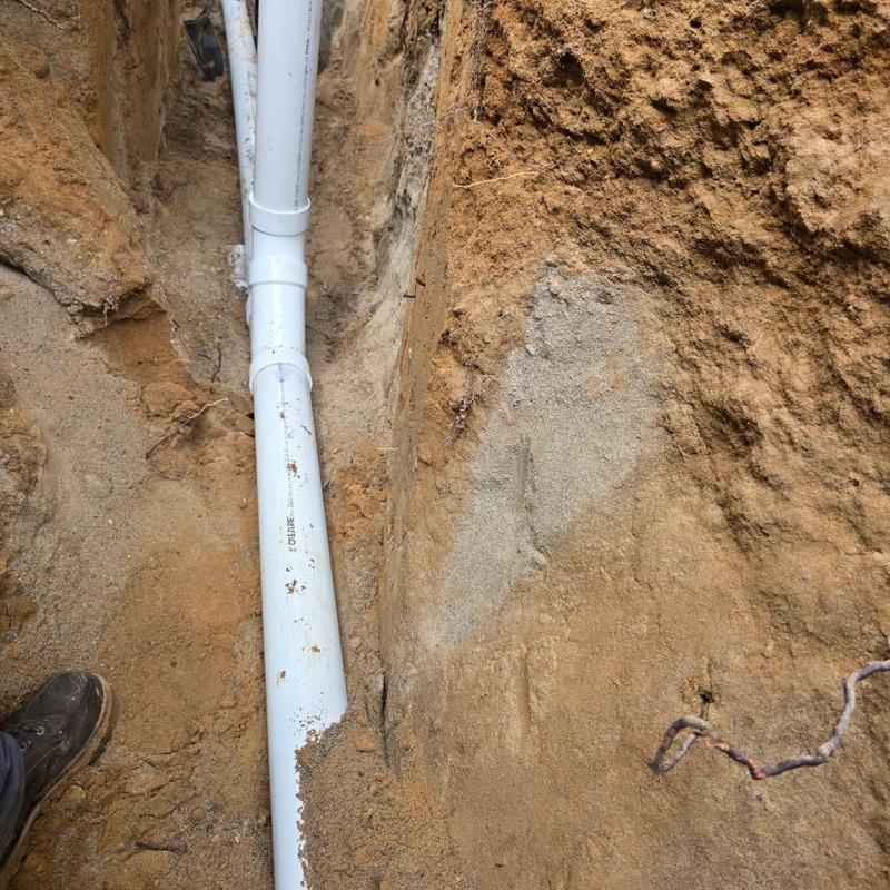 Sewer pipe installation in excavated trench