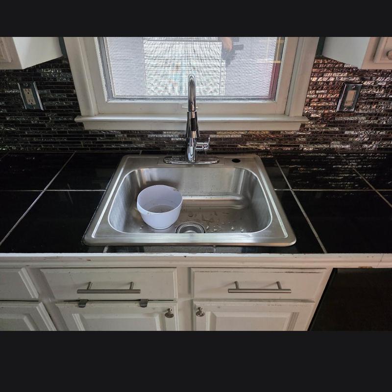 Kitchen sink and faucet installation with drain