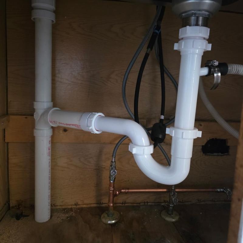 Kitchen sink drain pipes and trap installation under cabinet