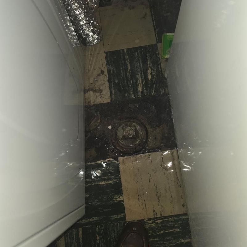 Basement floor sewer cleanout with water damage Basement floor sewer cleanout with water damage