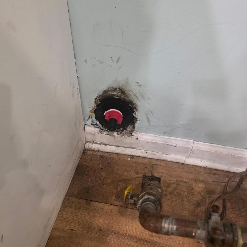 Sewer cleanout cap with exposed pipe and valve Sewer cleanout cap with exposed pipe and valve