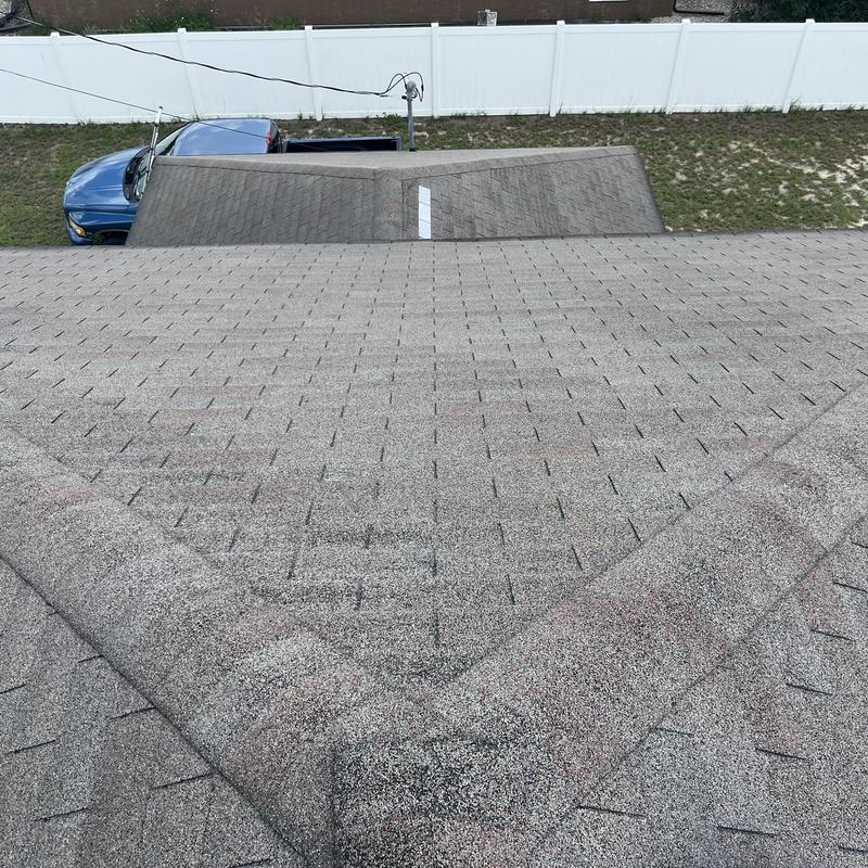 Shingle roof ridge and valley with old shingles Shingle roof ridge and valley with old shingles