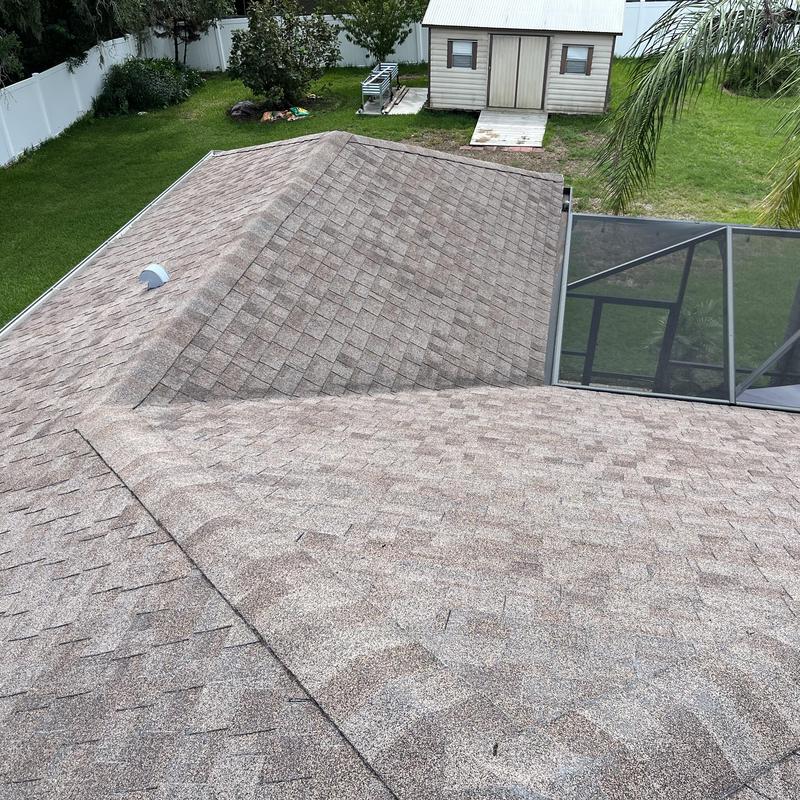 Shingle roof with ridge vent and screened enclosure Shingle roof with ridge vent and screened enclosure