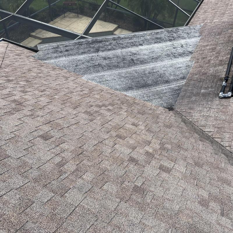 Shingle roof with patch and skylight frame sections Shingle roof with patch and skylight frame sections