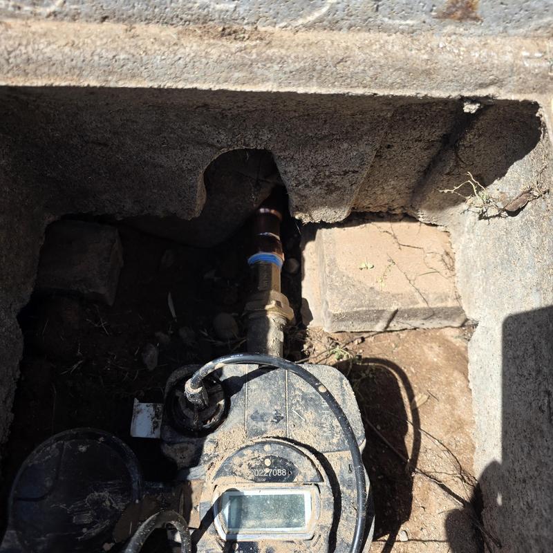 Water meter with service line pipe replacement under slab