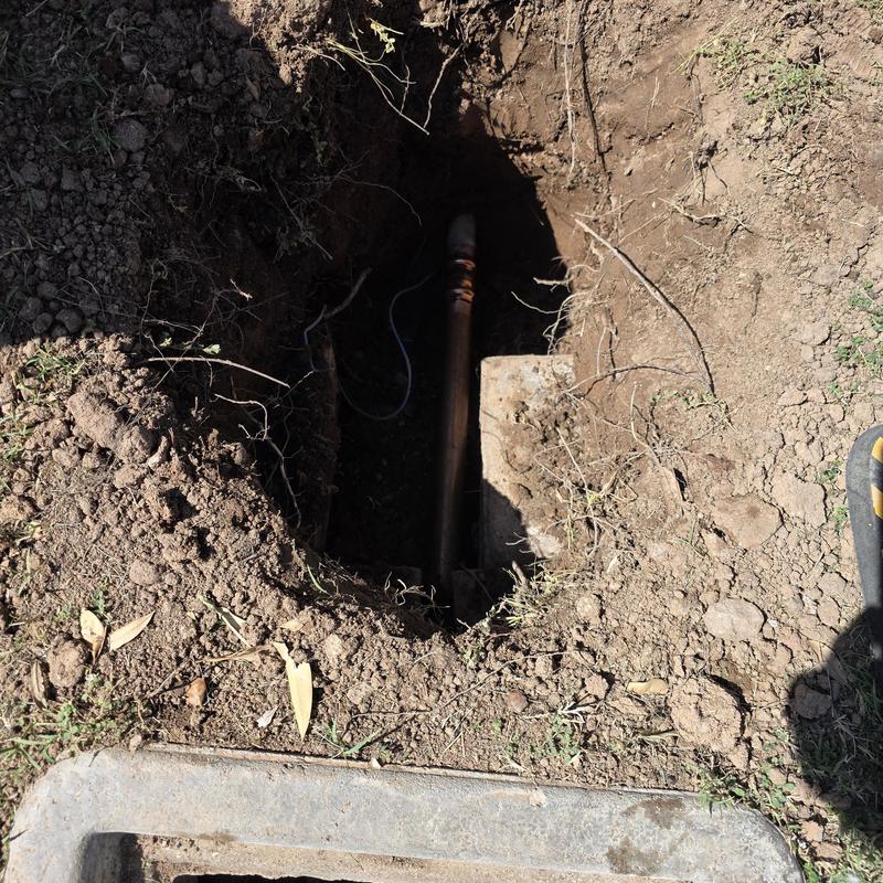 Water service pipe replacement in dug trench near meter