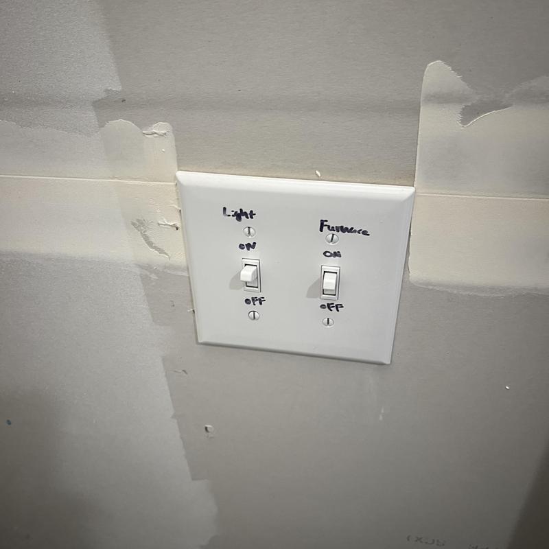 Furnace power switch on wall panel