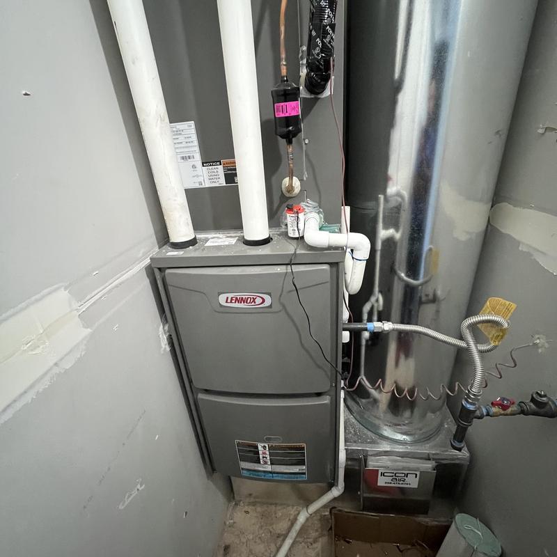 Lennox HVAC furnace with connected ductwork and pipes