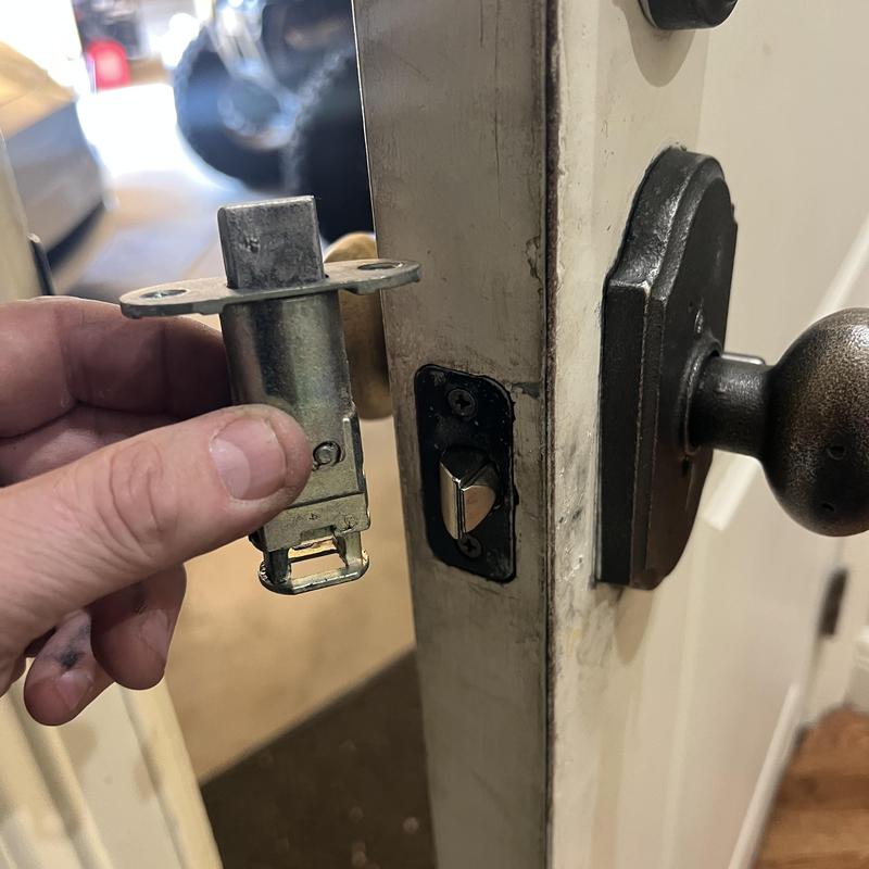 Weslock door knob latch replacement in hand Weslock door knob latch replacement in hand