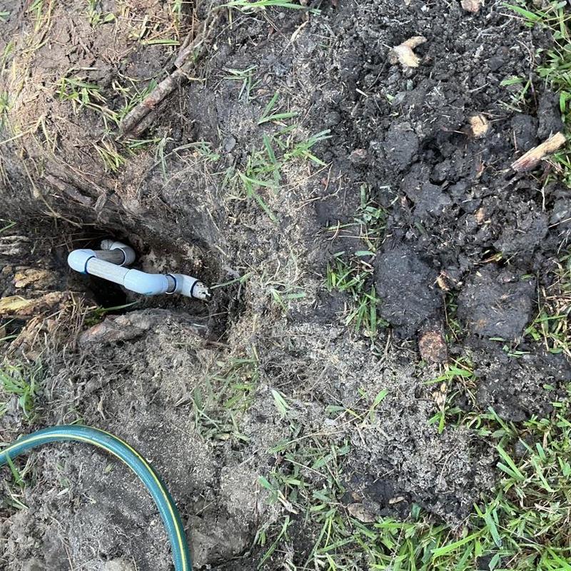 Underground water service pipe exposed for repair Underground water service pipe exposed for repair