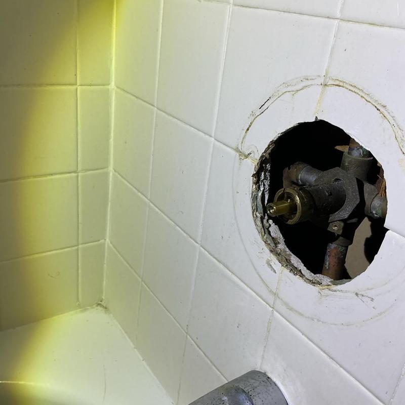 Shower valve cartridge installed in tiled wall cavity