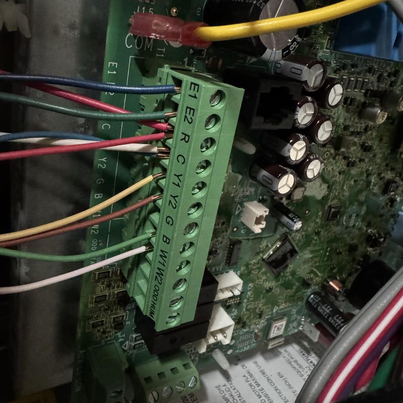 Heat pump control board wiring connections close-up Heat pump control board wiring connections close-up