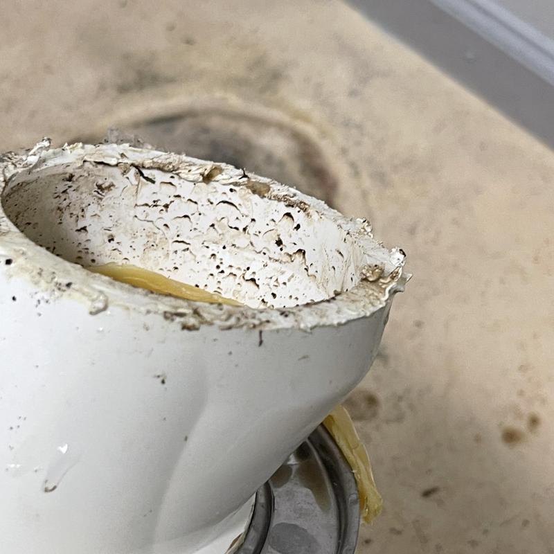 Toilet flange with debris and wear before replacement Toilet flange with debris and wear before replacement