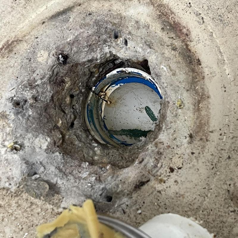 Toilet flange and drain pipe exposed for cleaning Toilet flange and drain pipe exposed for cleaning