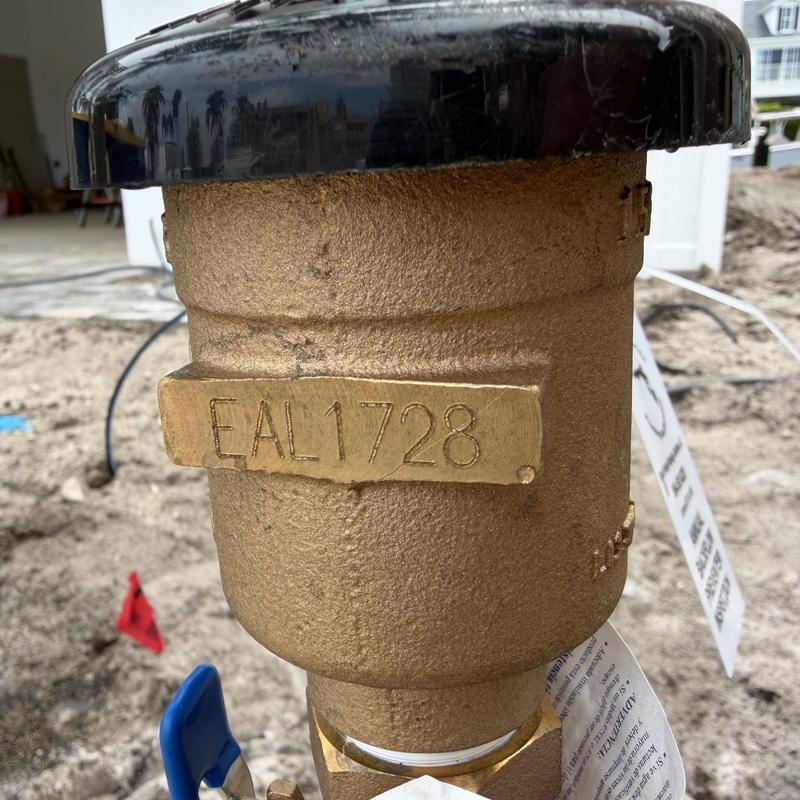Backflow prevention device with identification tag