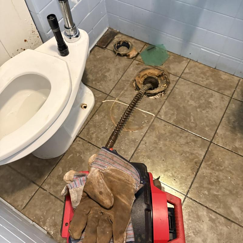 Main line auger in toilet flange during replacement Main line auger in toilet flange during replacement